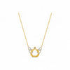 Gold necklace with a horse shoe pendant on a white background