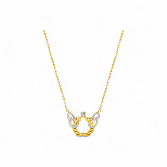 Gold necklace with a horse shoe pendant on a white background