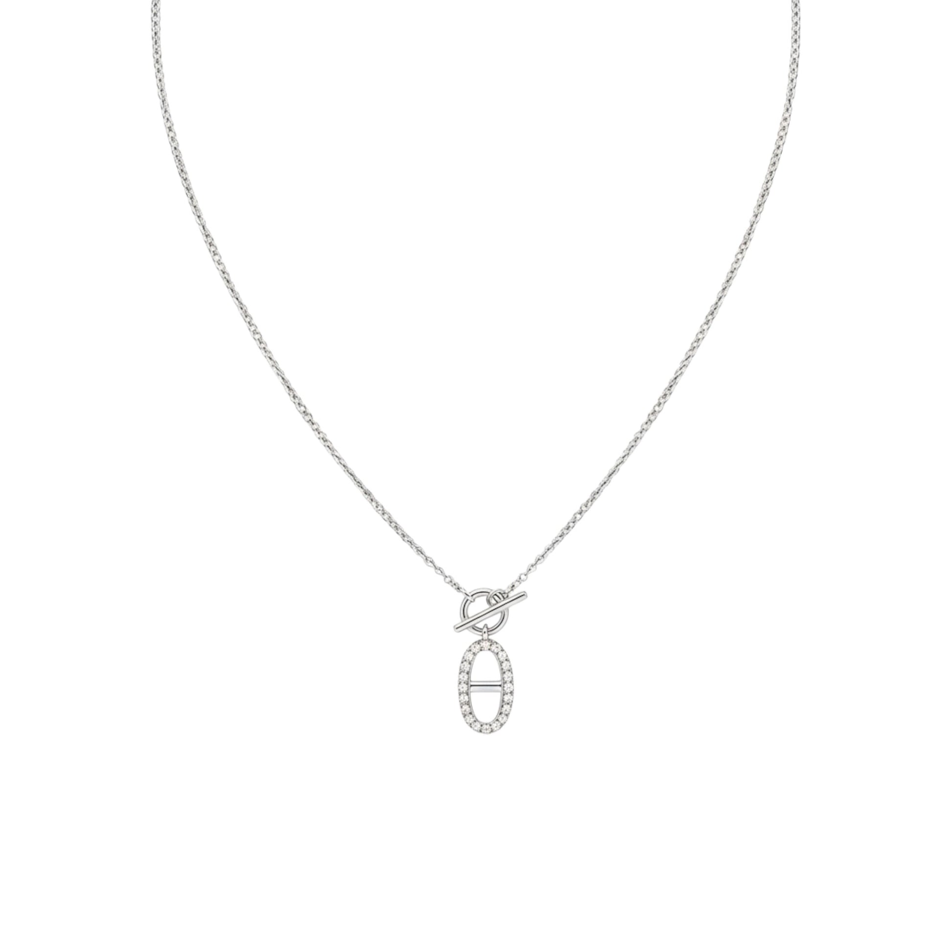 Silver necklace with a heart and oval pendant on a white background