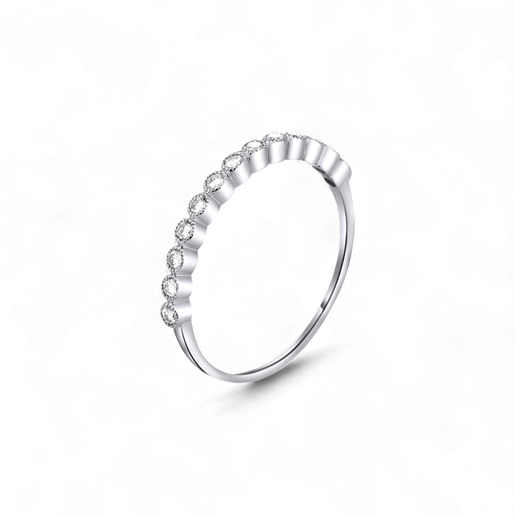 Silver ring with small diamonds on a white background