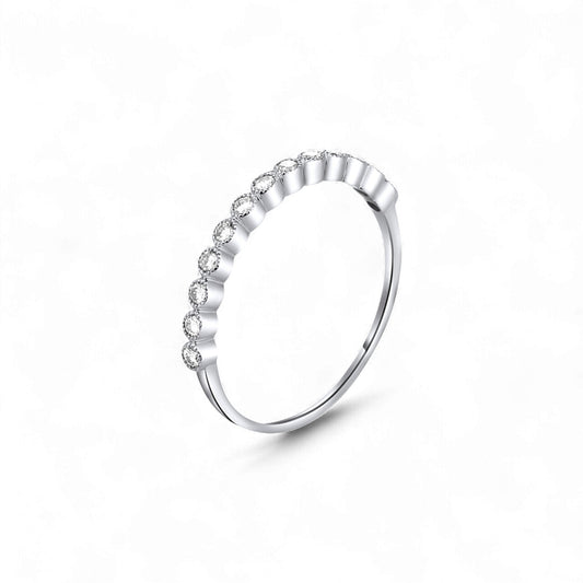 Silver ring with small diamonds on a white background