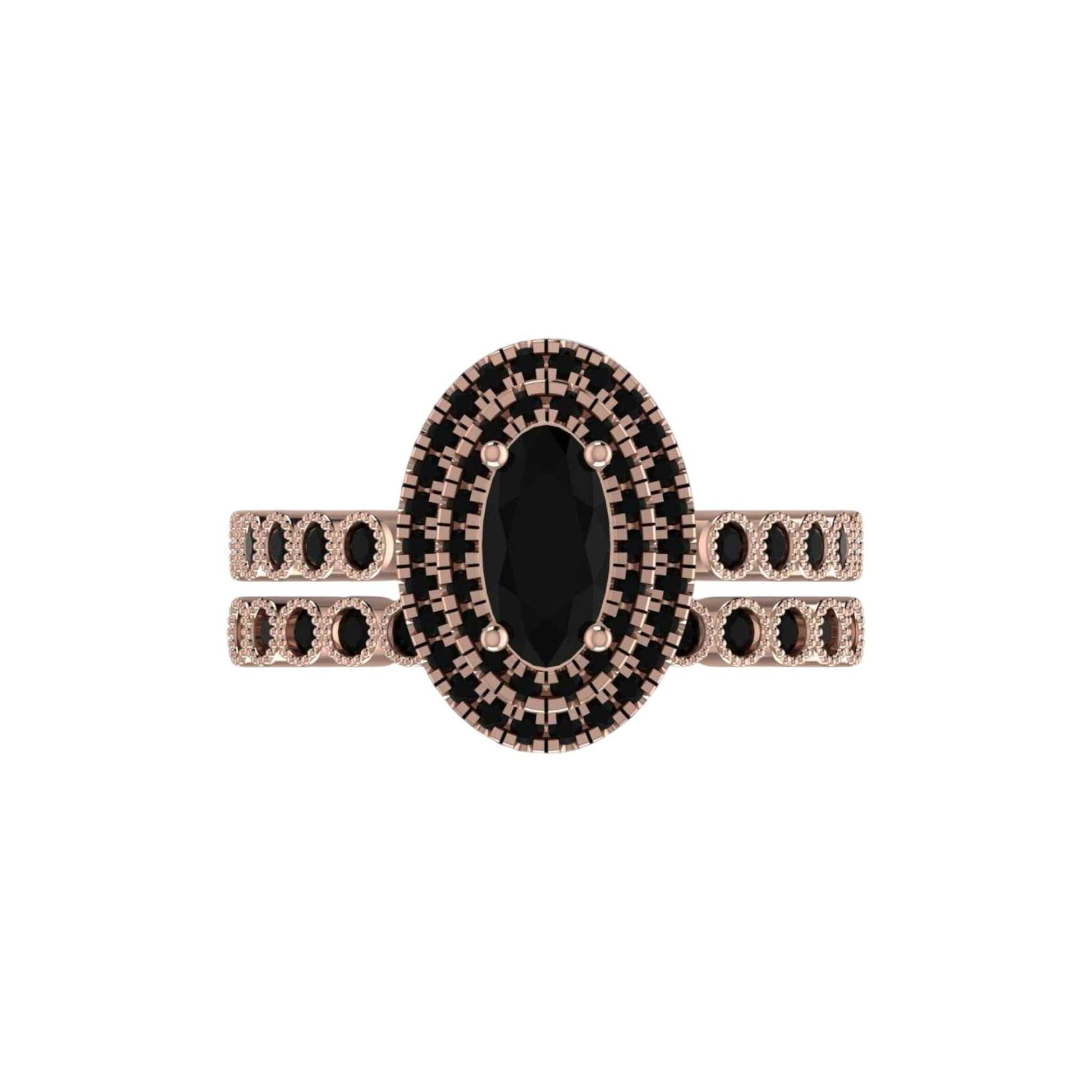 Rose gold ring with a black gemstone on a white background