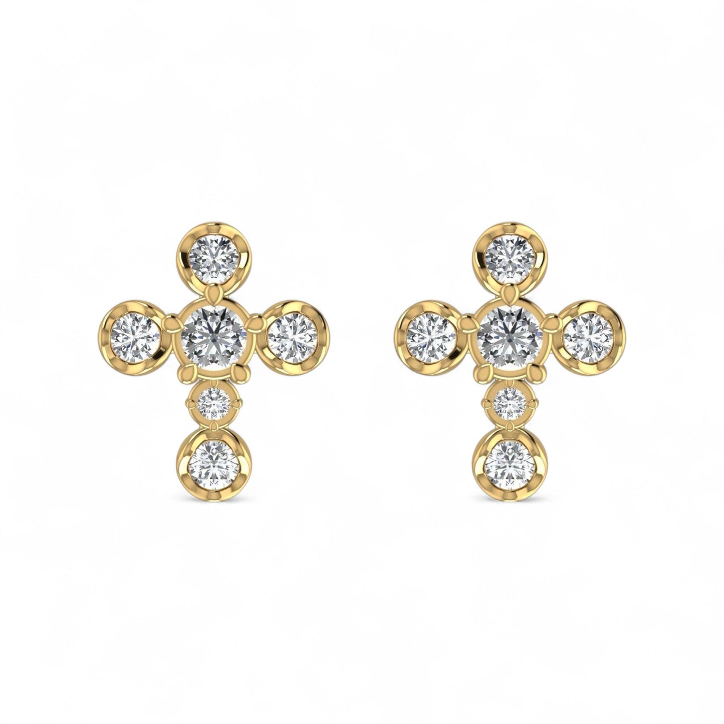 Gold earrings with clear gemstones on a white background