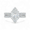 Diamond ring with pear-shaped center stone on a white background