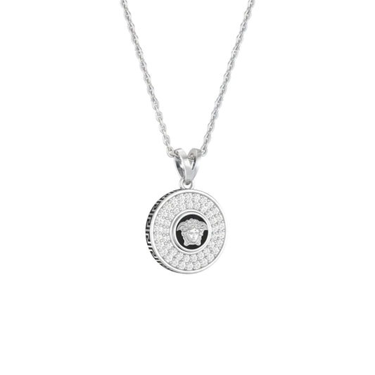Silver necklace with a round pendant on a white background