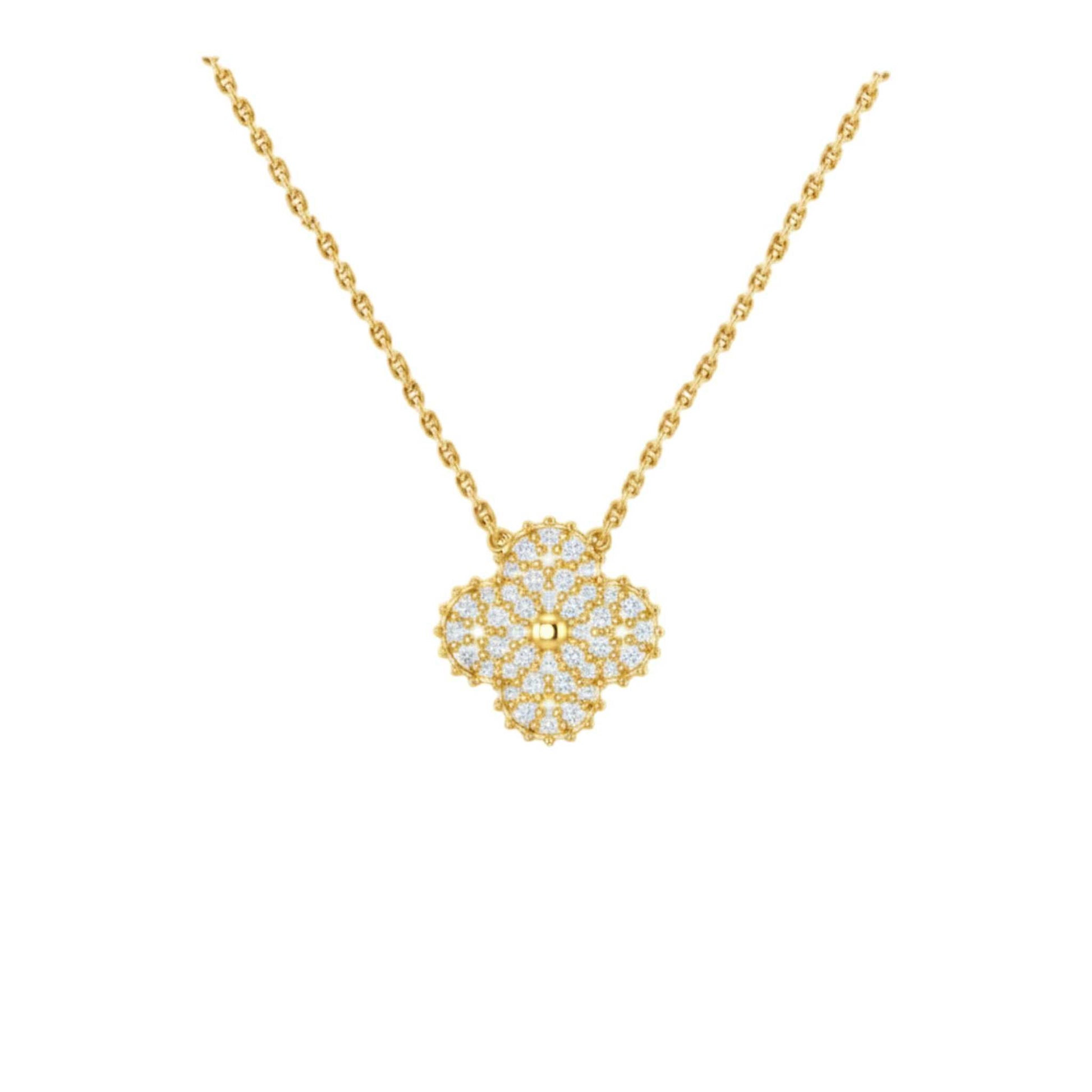 Gold necklace with a floral pendant on a white background