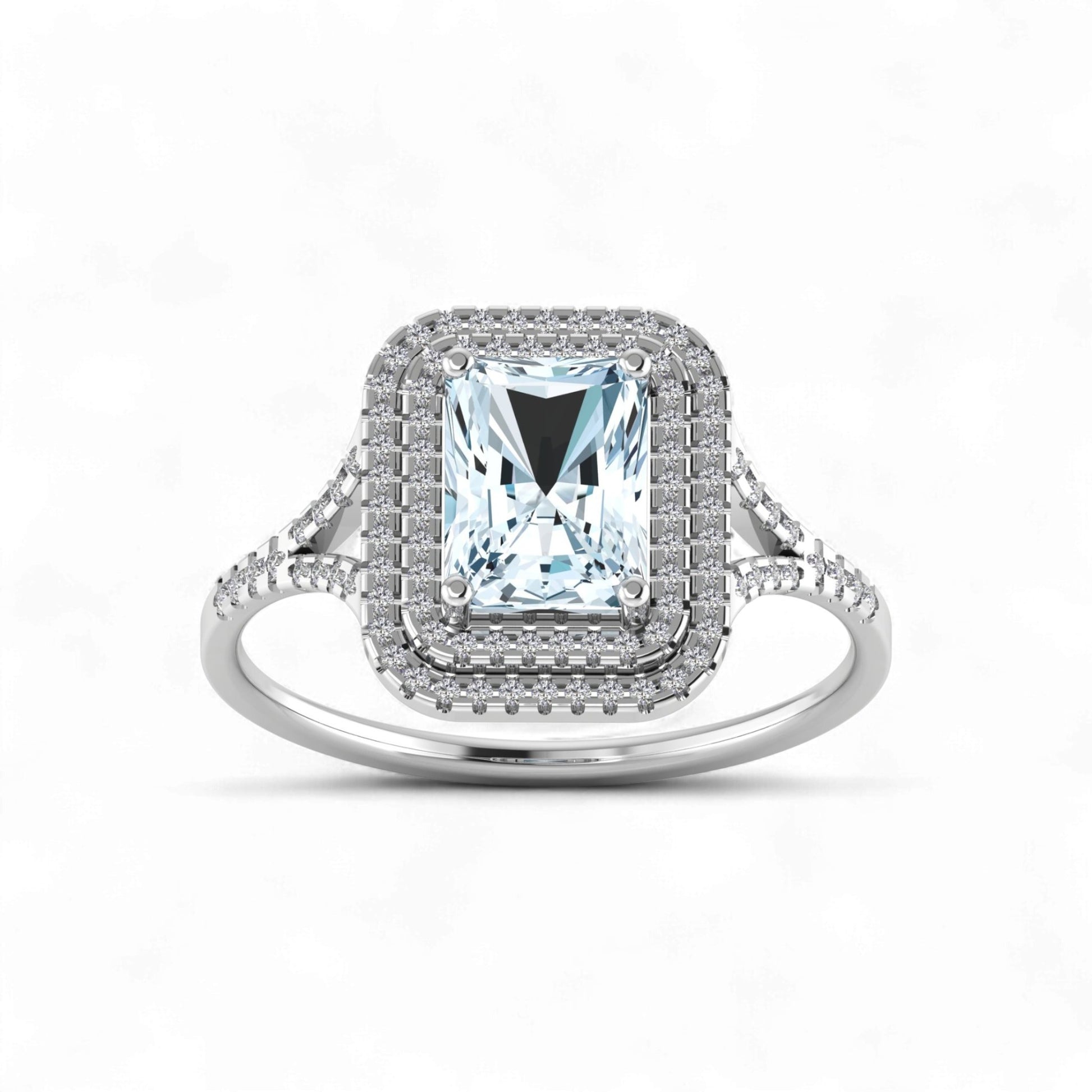 Silver ring with a large central gemstone and smaller stones on a white background