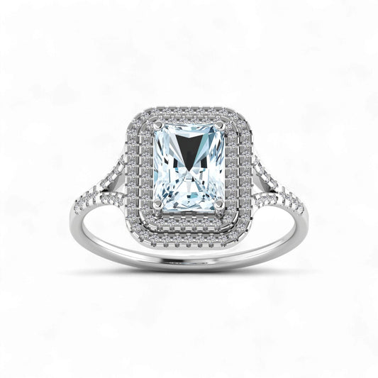 Silver ring with a large central gemstone and smaller stones on a white background