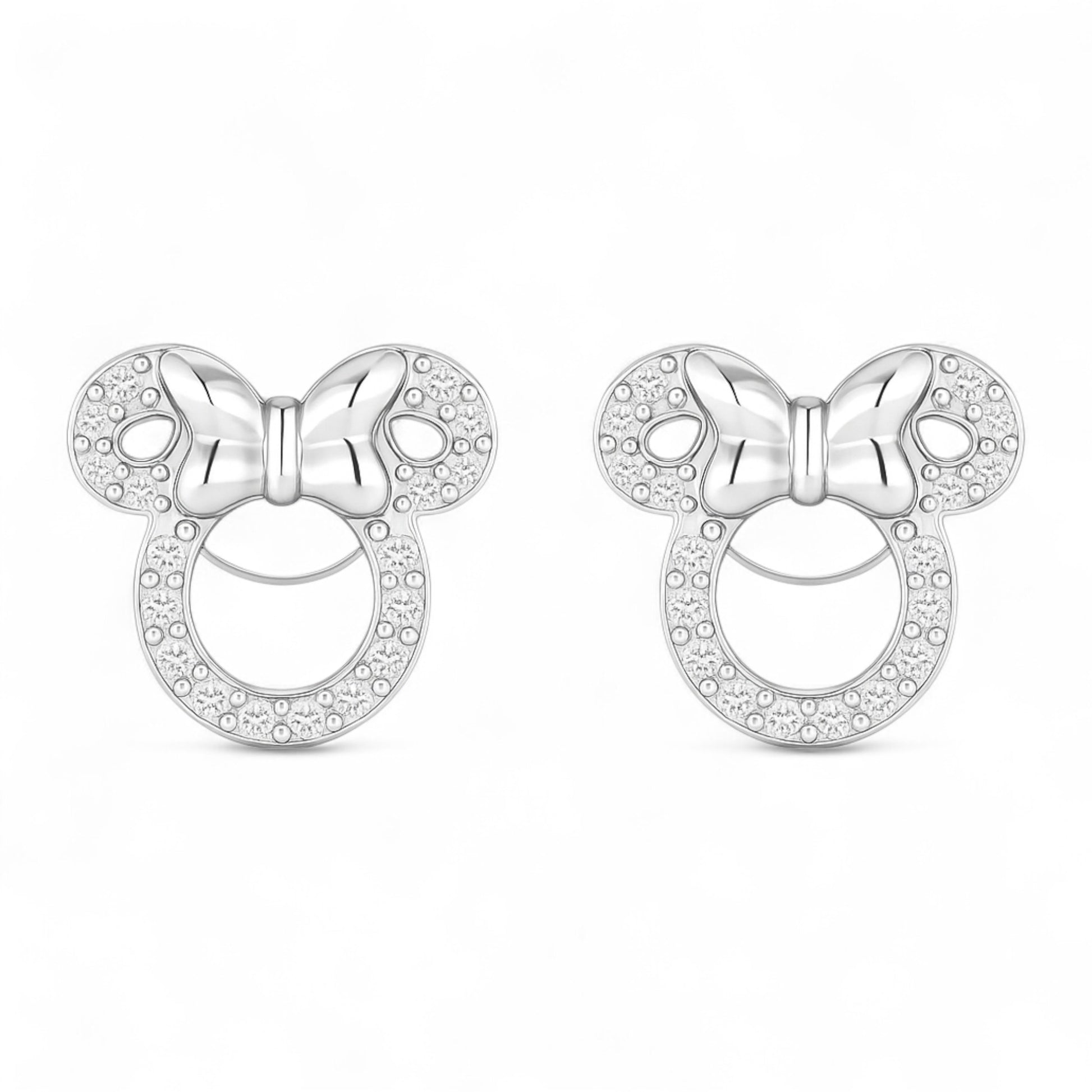 Silver bow-shaped earrings with clear stones on a white background
