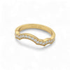 Gold ring with diamond accents on a white background