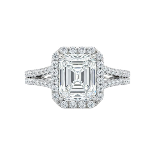 Diamond ring with emerald-cut center stone on a white background