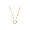 Gold necklace with a unique pendant on a white background