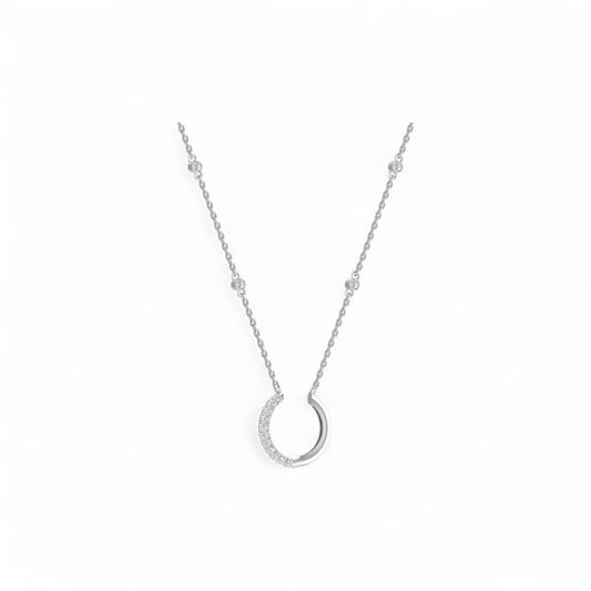 Silver necklace with a unique pendant on a white background