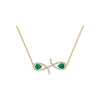 Gold necklace with emerald green gemstones on a white background