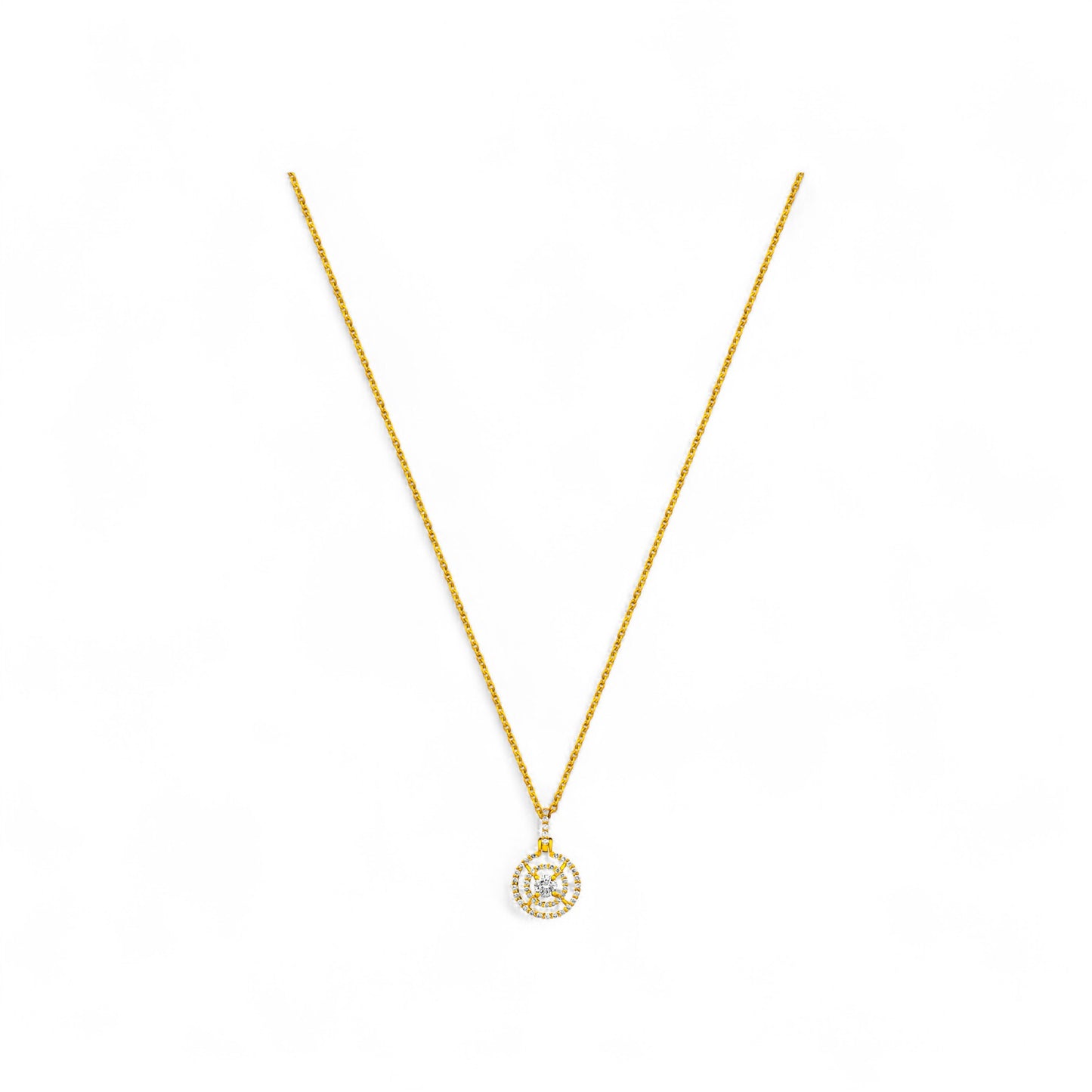 Gold necklace with a small pendant on a white background