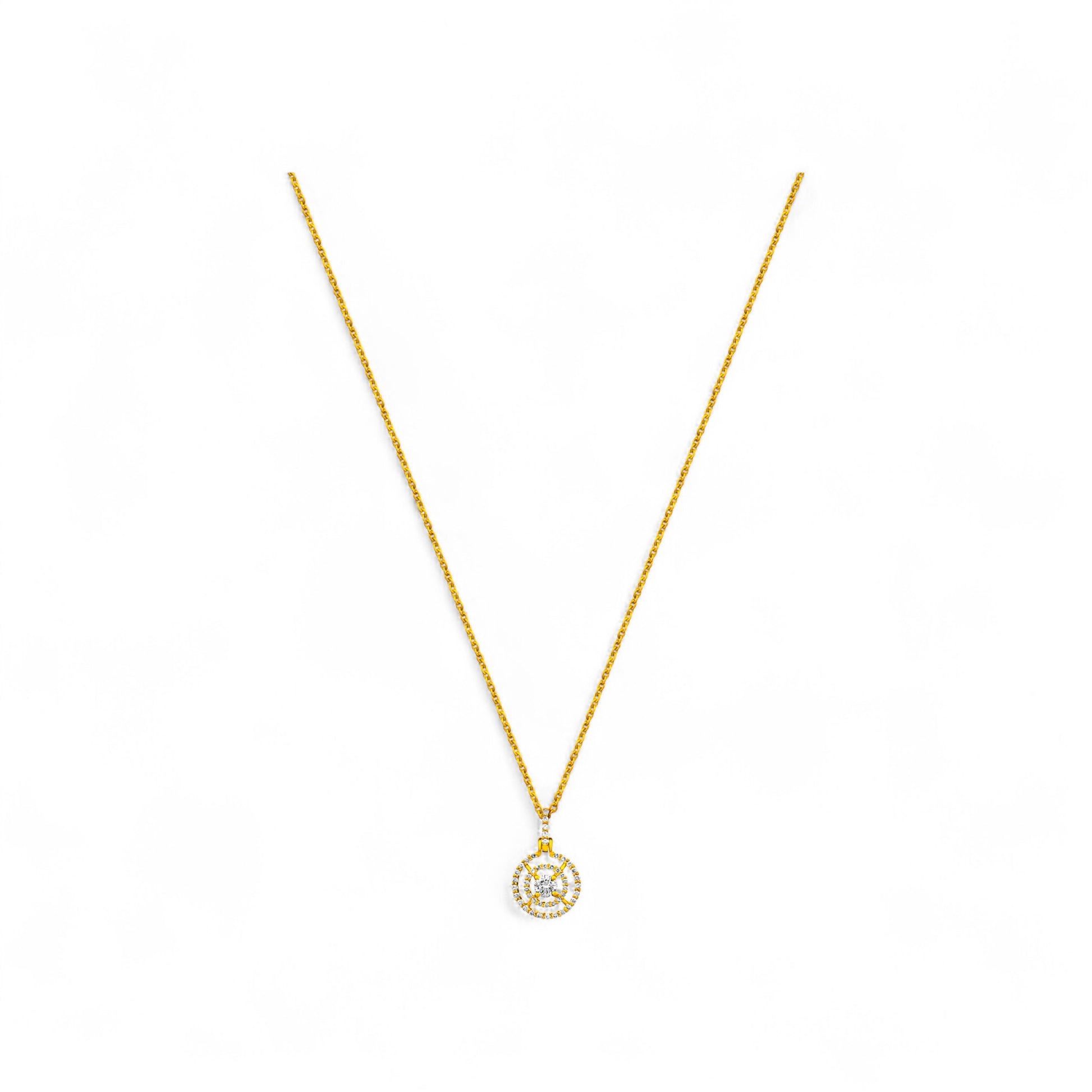 Gold necklace with a small pendant on a white background