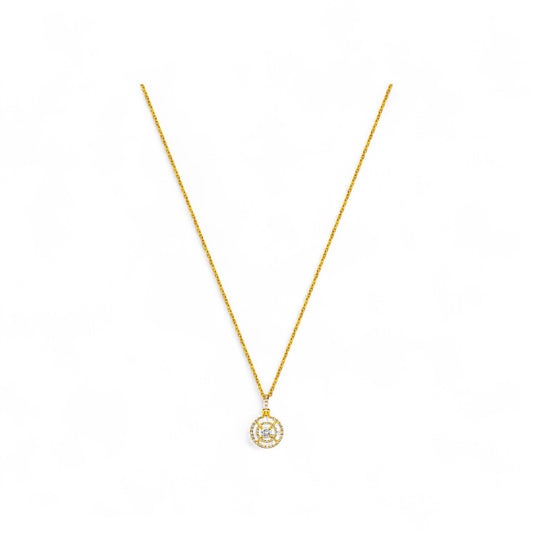 Gold necklace with a small pendant on a white background