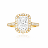 Gold ring with a large central diamond and smaller diamonds around on a white background