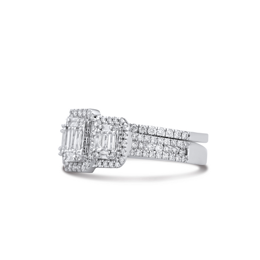 Diamond ring with emerald-cut center stone and smaller diamonds on a white background