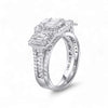 Diamond ring with emerald-cut center stone on a white background