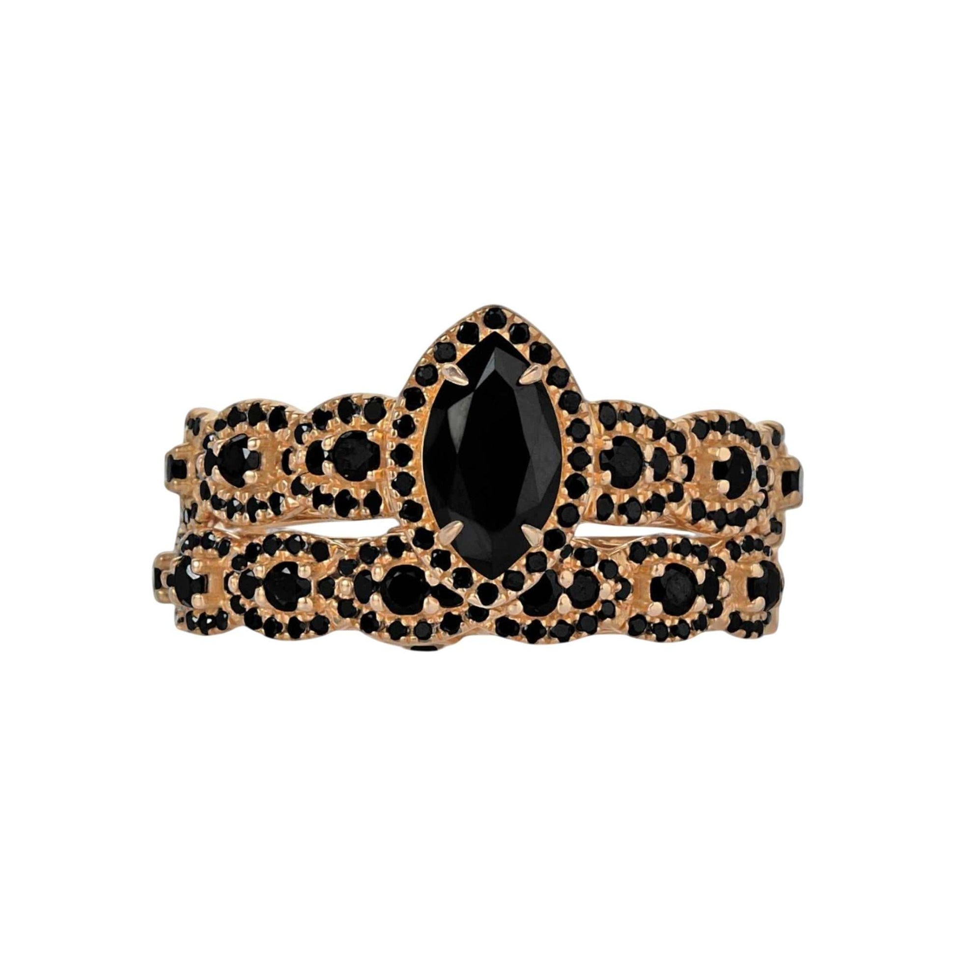 Gold and black decorative item on a white background