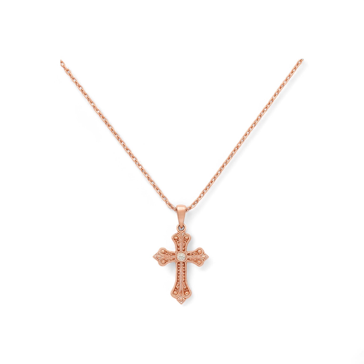 Rose gold cross necklace on a white background