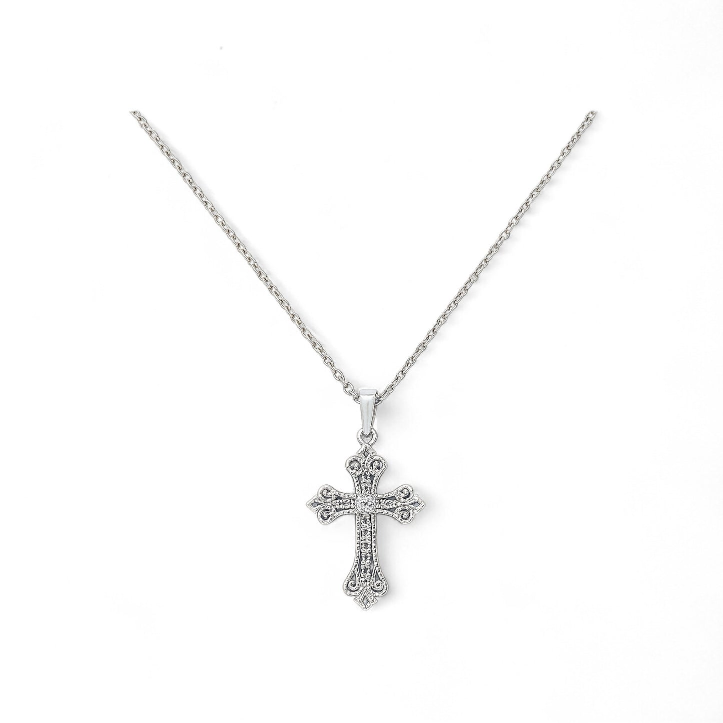 Silver cross necklace on a white background