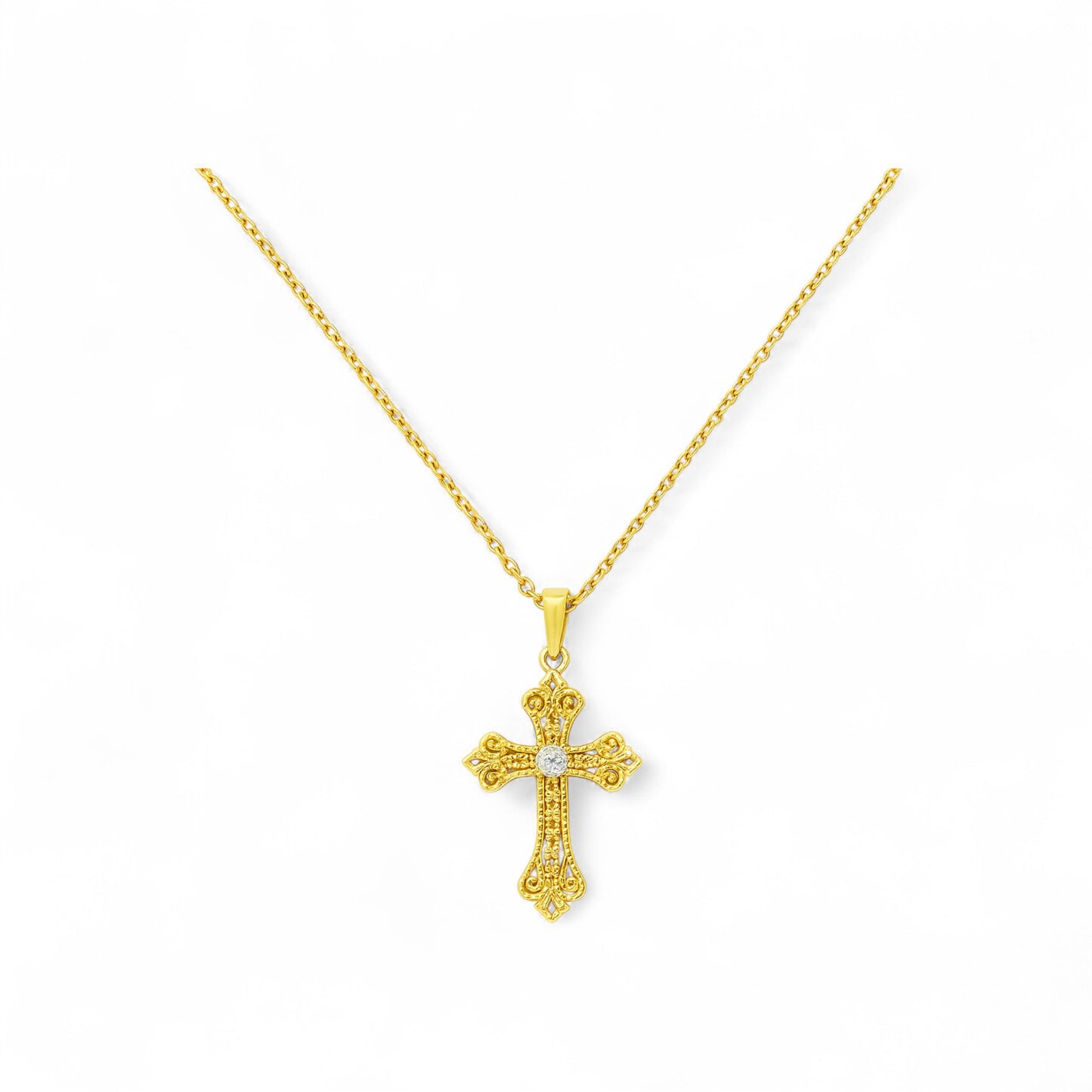 Gold cross pendant necklace on a white background