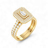 Gold ring with diamond accents on a white background