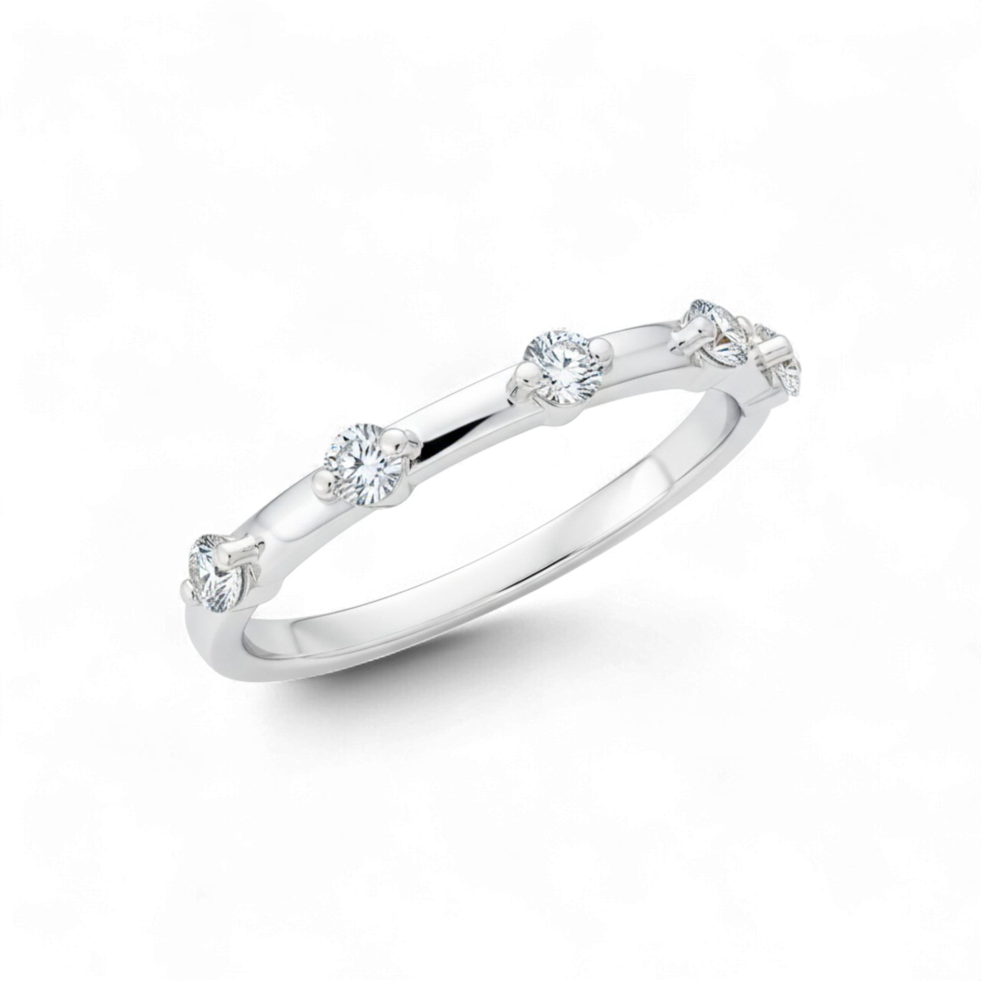 Silver ring with small diamonds on a white background