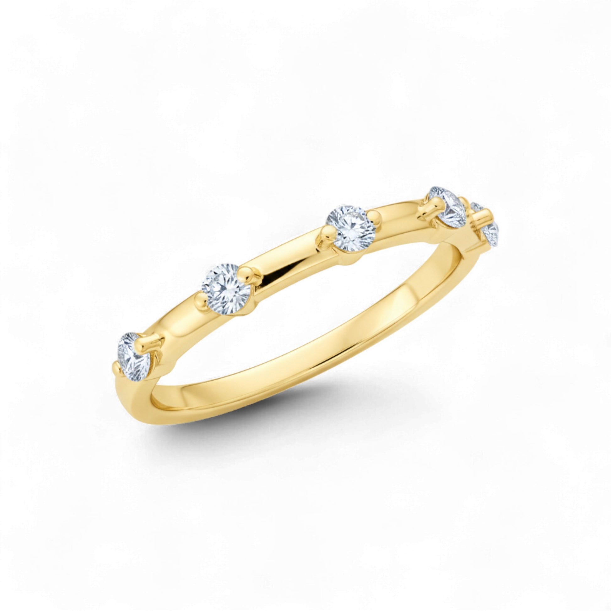 Gold ring with diamonds on a white background