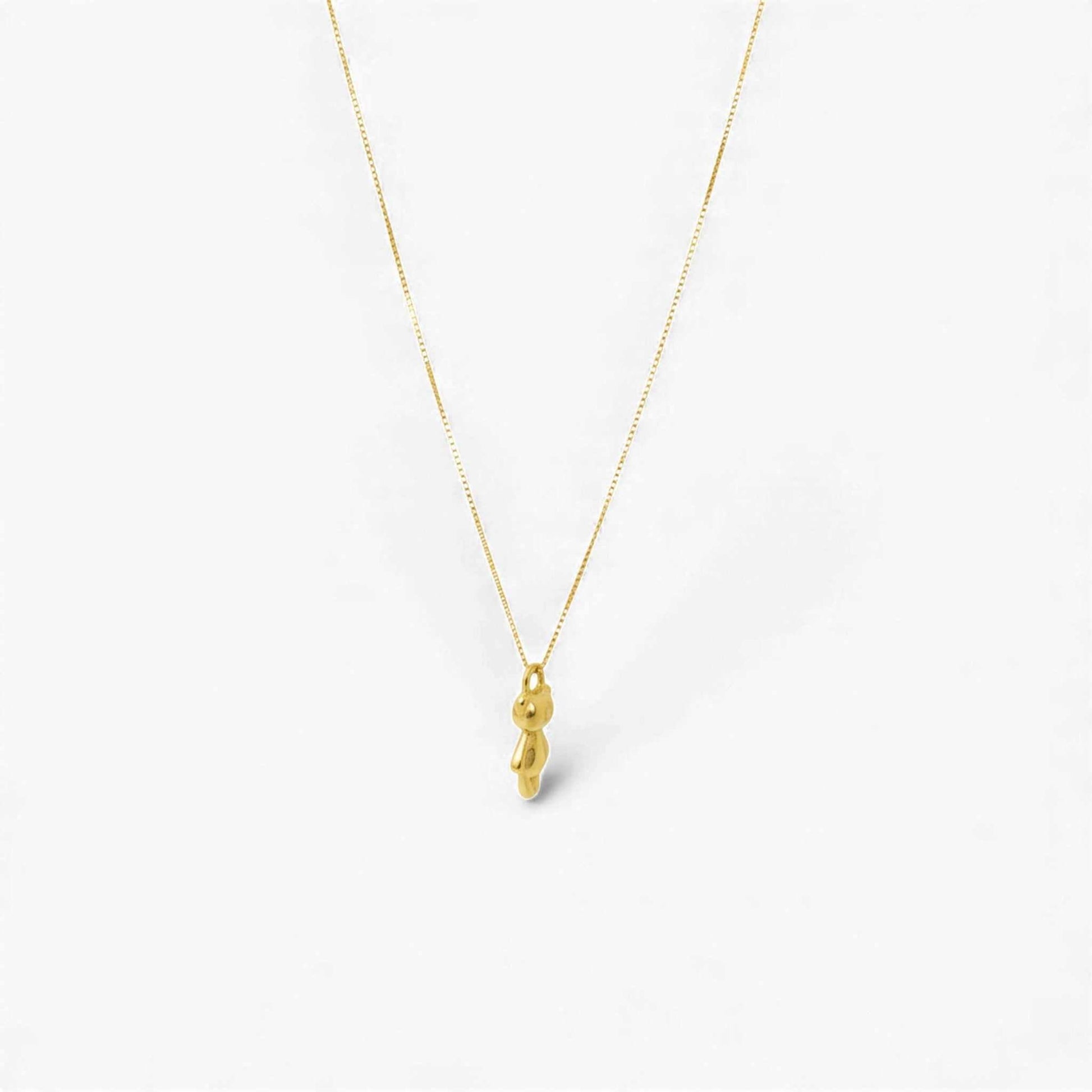 18KT gold teddy bear pendant necklace with fine detailing and smooth finish