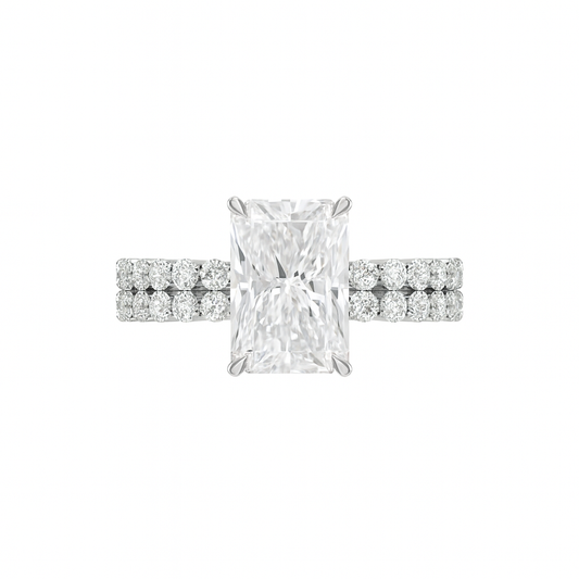 Diamond ring with a rectangular center stone and smaller round stones on a white background