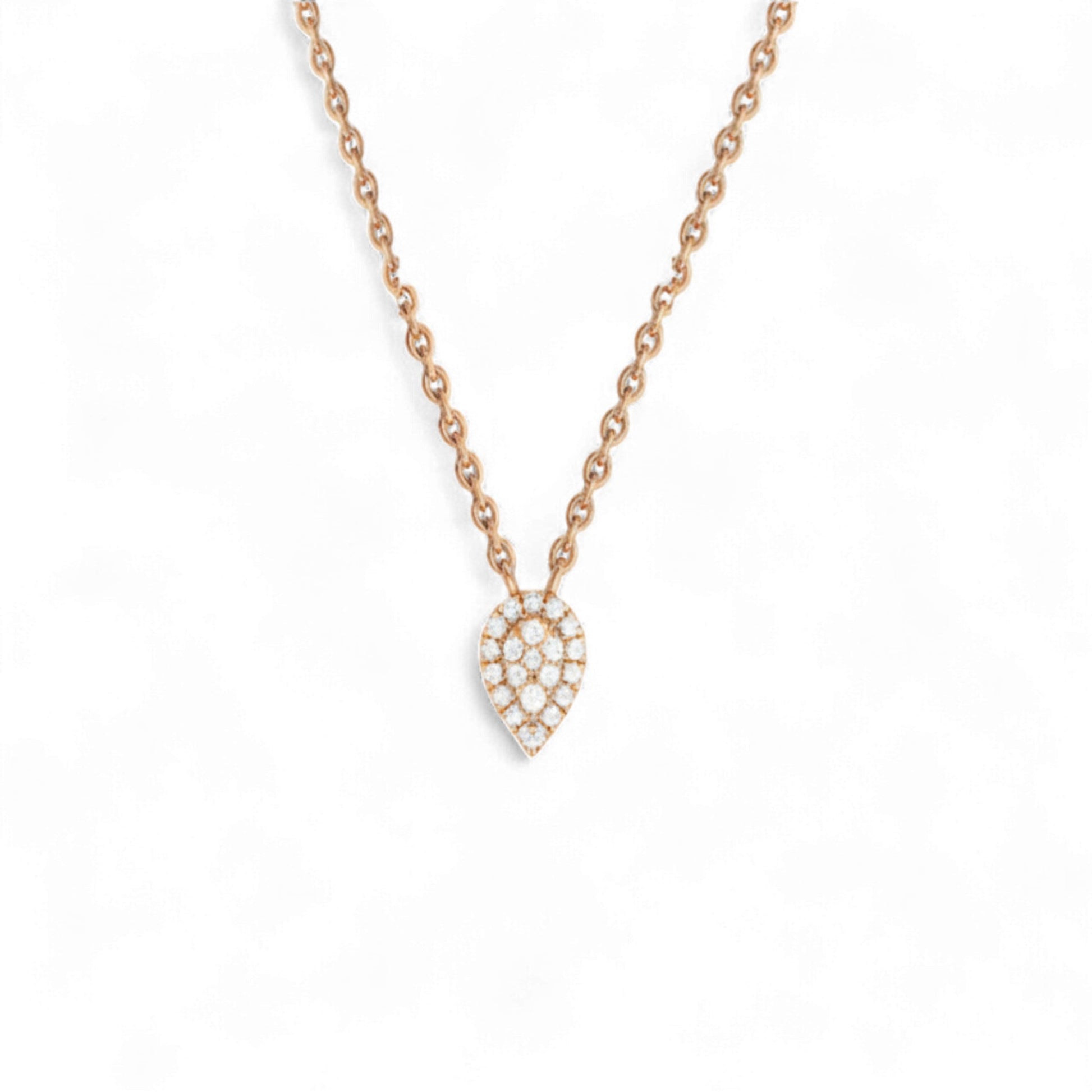 Rose gold necklace with a teardrop-shaped diamond pendant on a white background