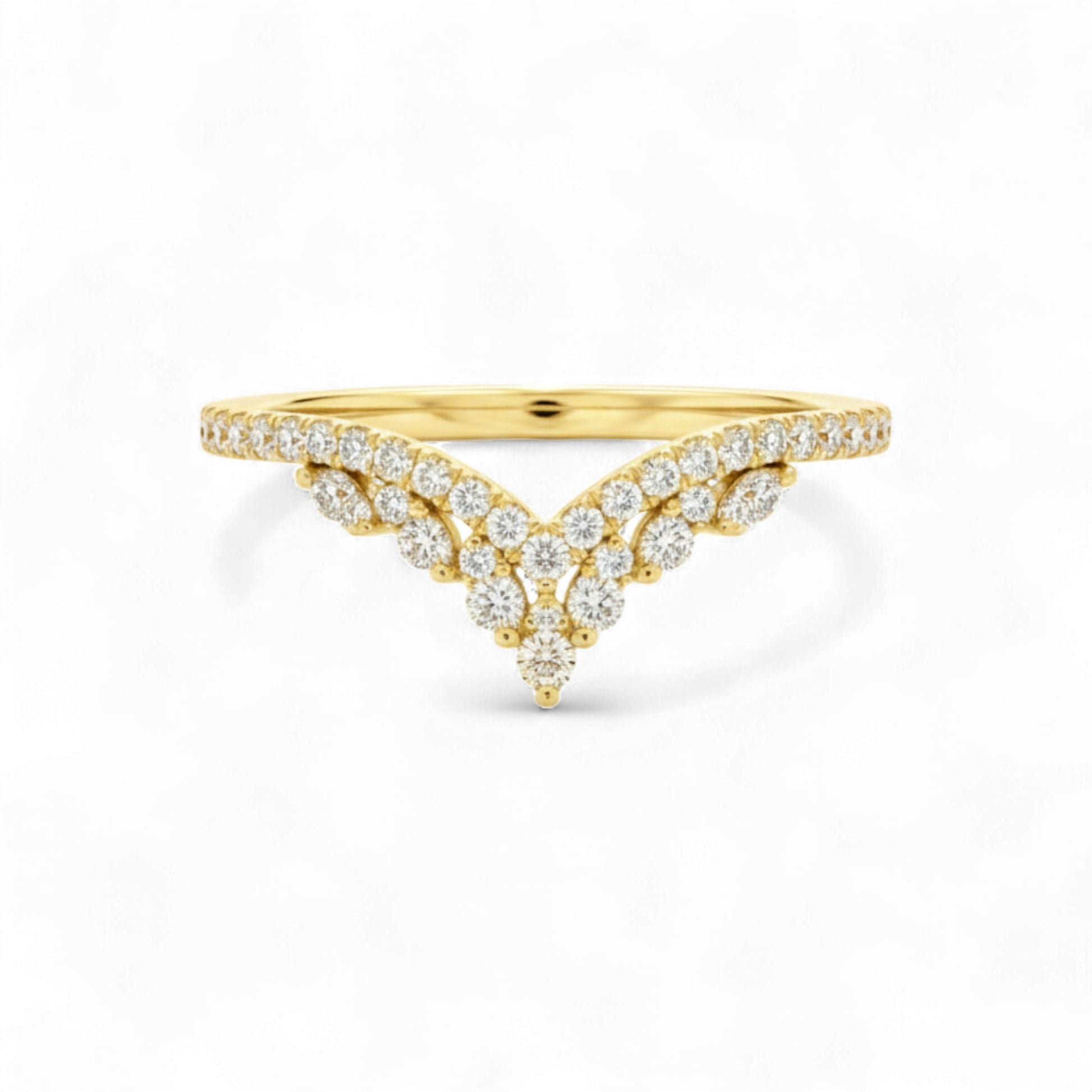 Gold ring with diamond accents on a white background