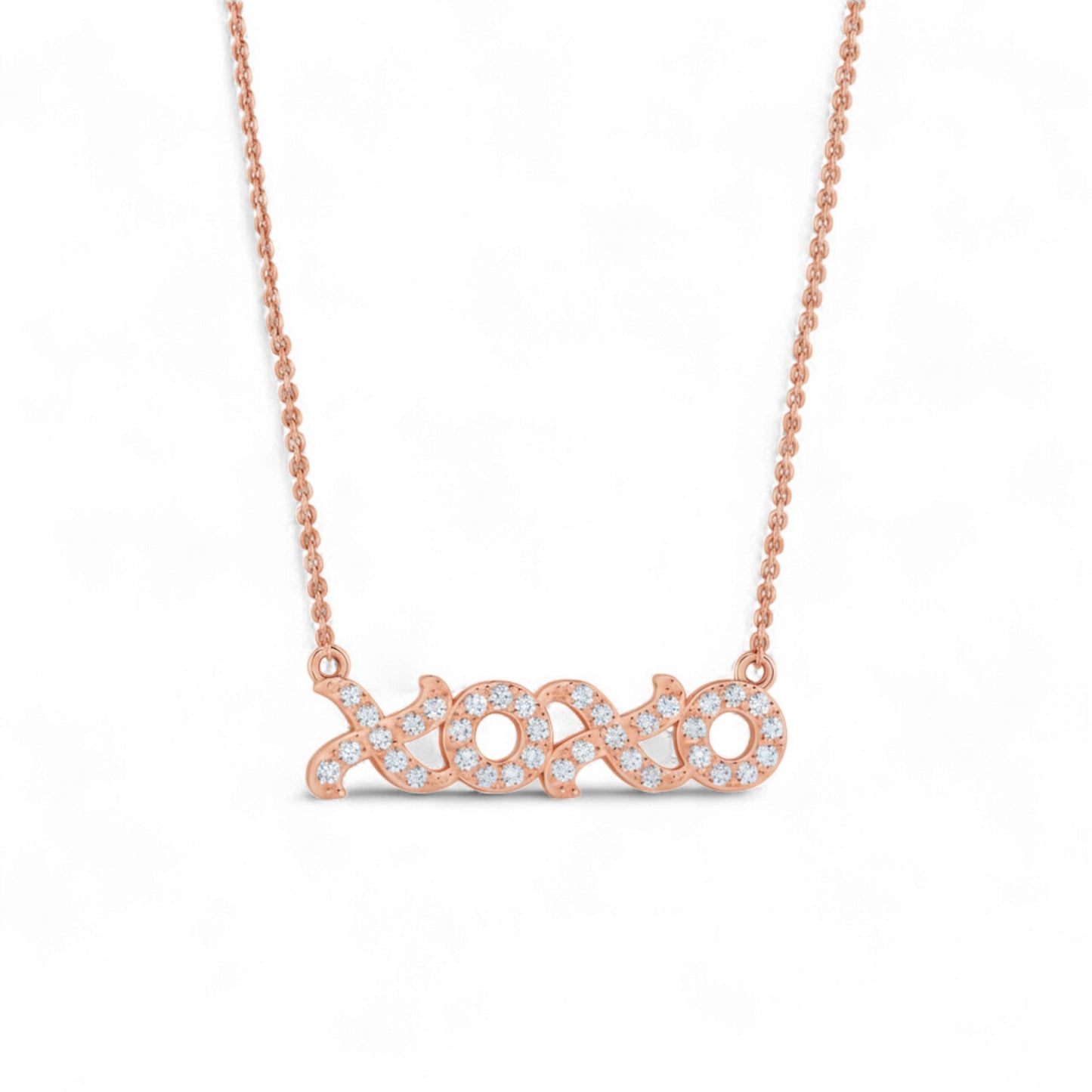 Rose gold necklace with a diamond-encrusted pendant on a white background