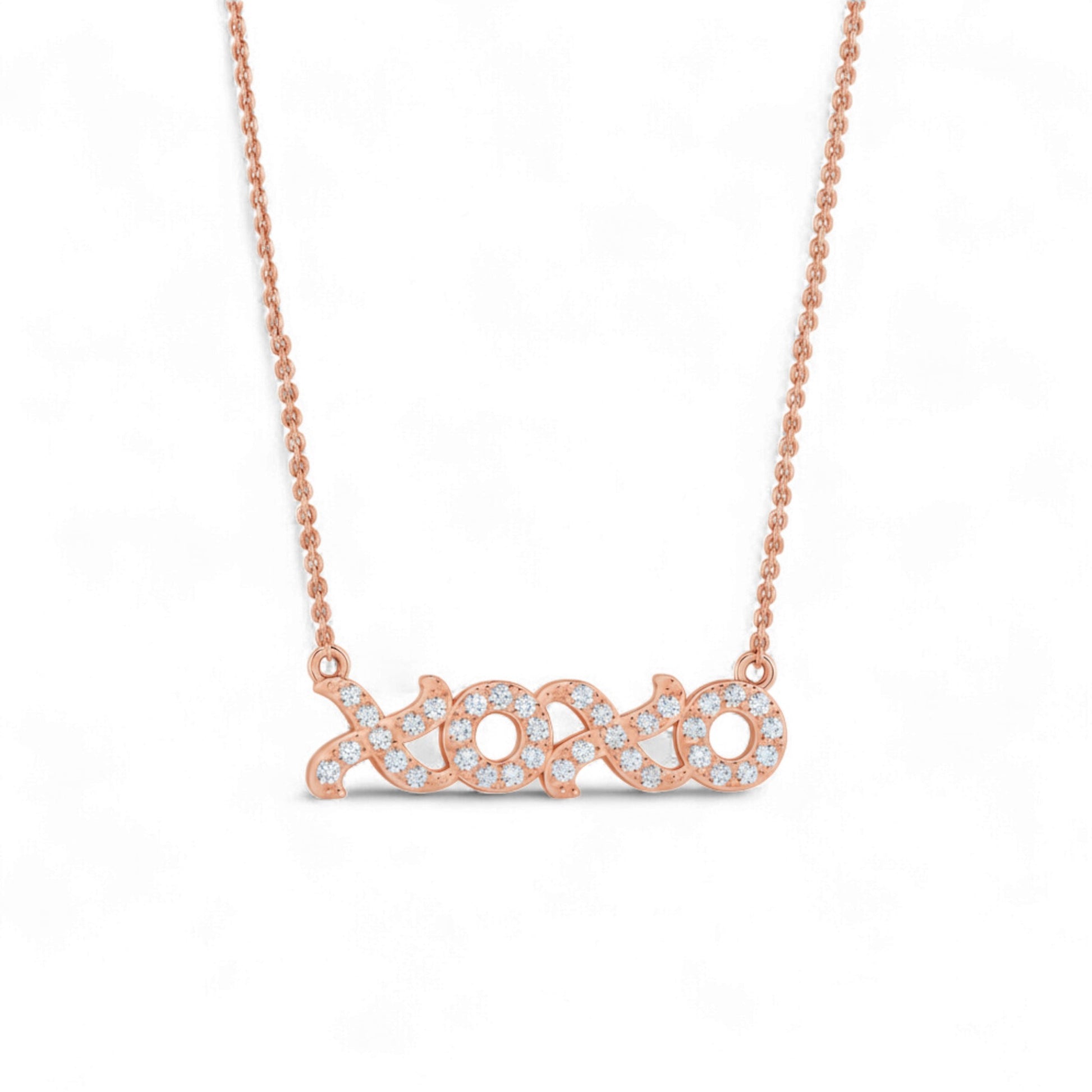 Rose gold necklace with a diamond-encrusted pendant on a white background