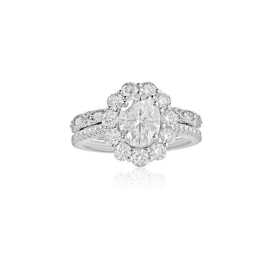 Diamond ring with a pear-shaped center stone on a white background