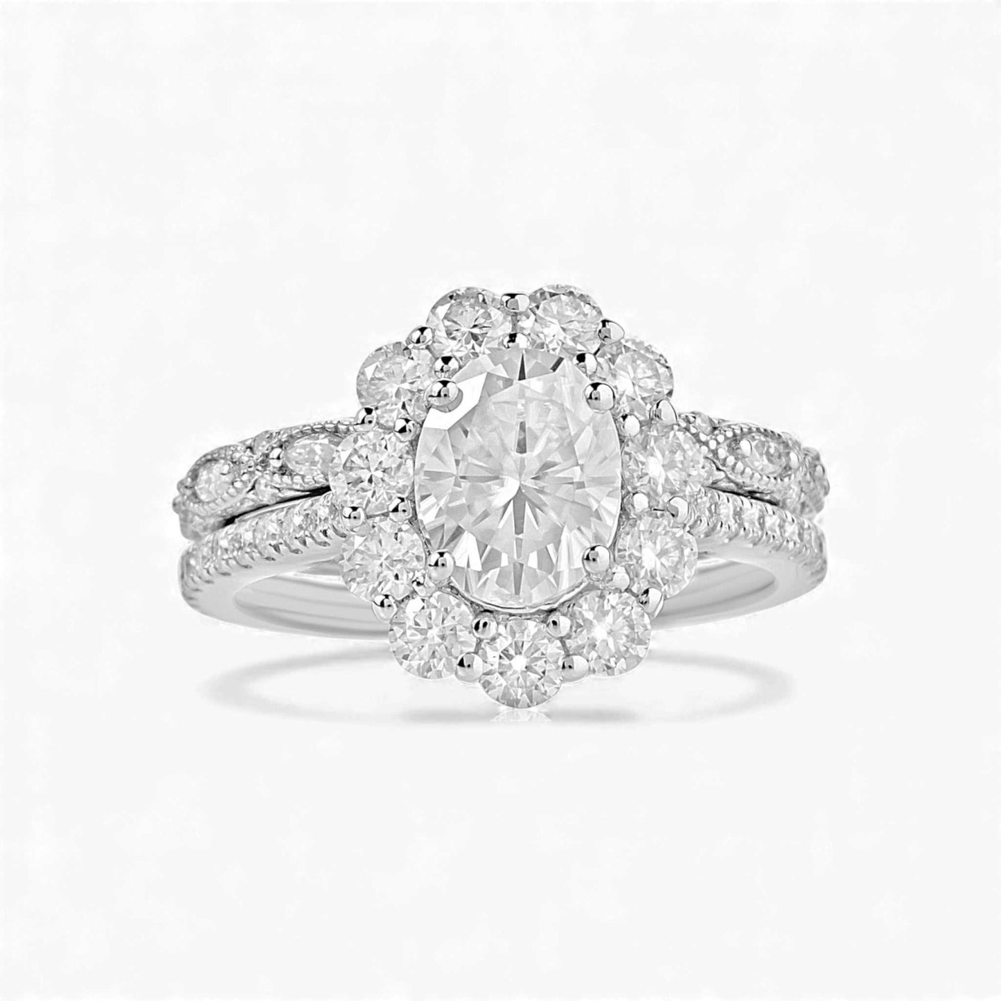 BOZ Lavie Oval Cut Moissanite bridal set in 925 sterling silver with oval center stone and pavé wedding band.