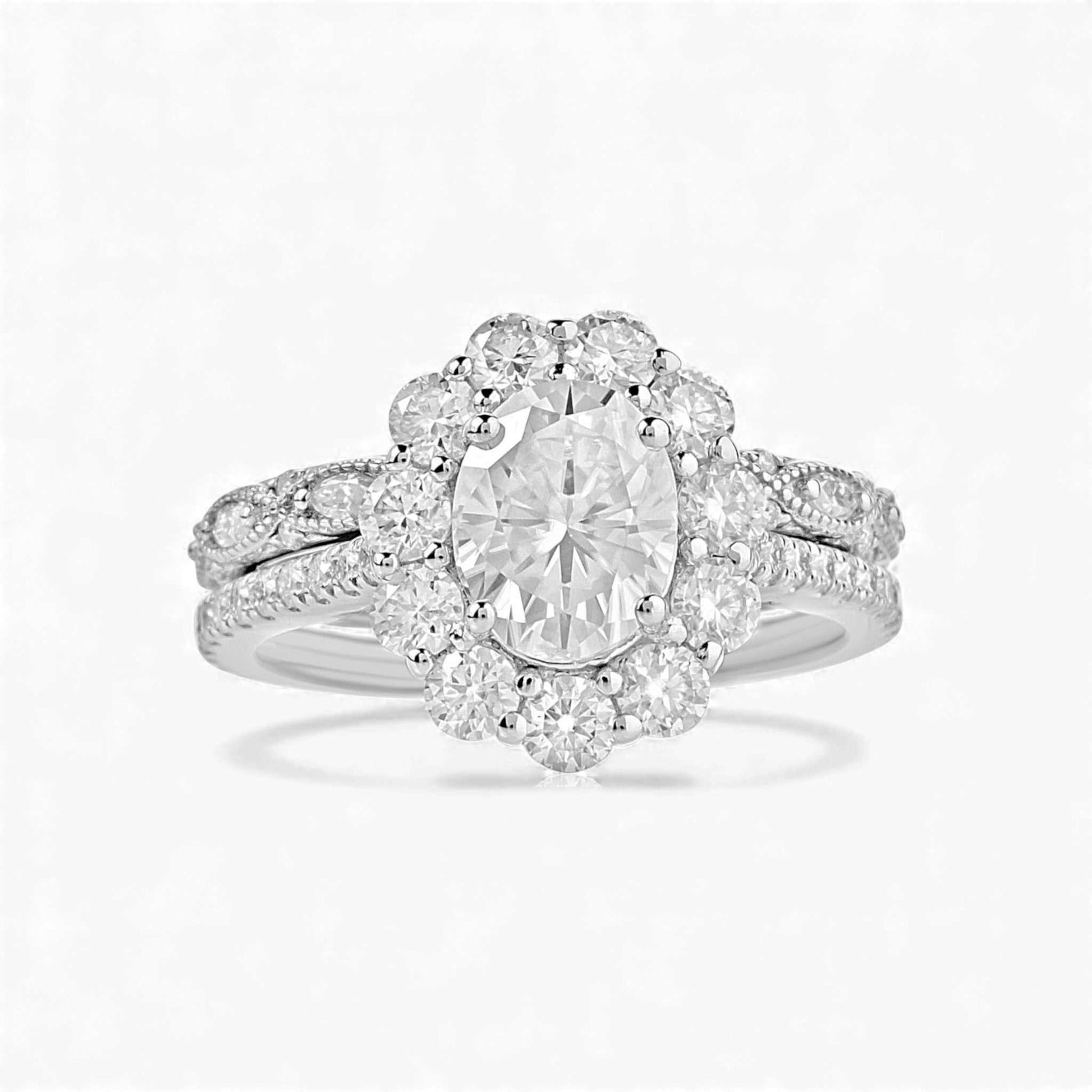 BOZ Lavie Oval Cut Moissanite bridal set in 925 sterling silver with oval center stone and pavé wedding band.