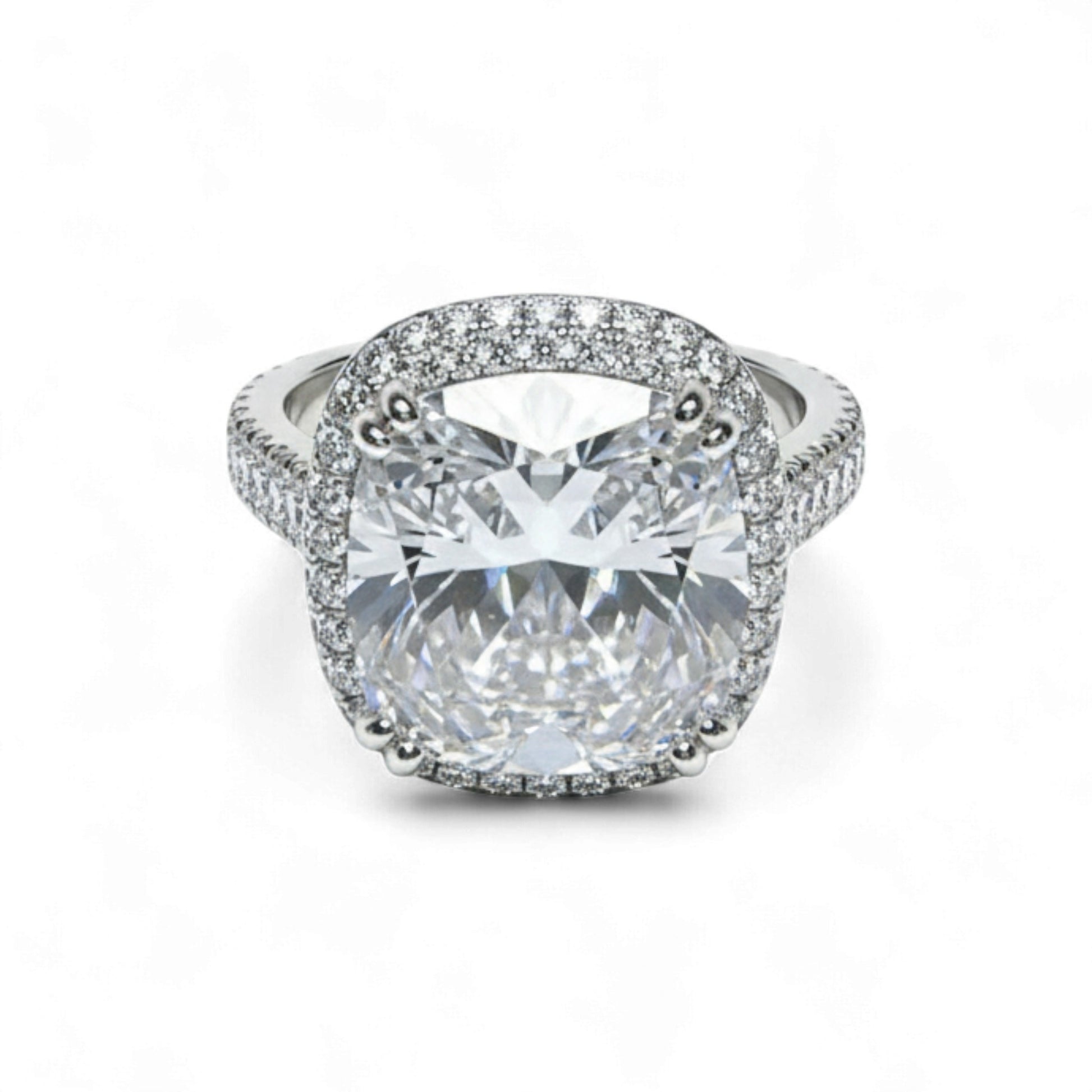 Diamond ring with a large central gemstone and smaller stones around on a white background