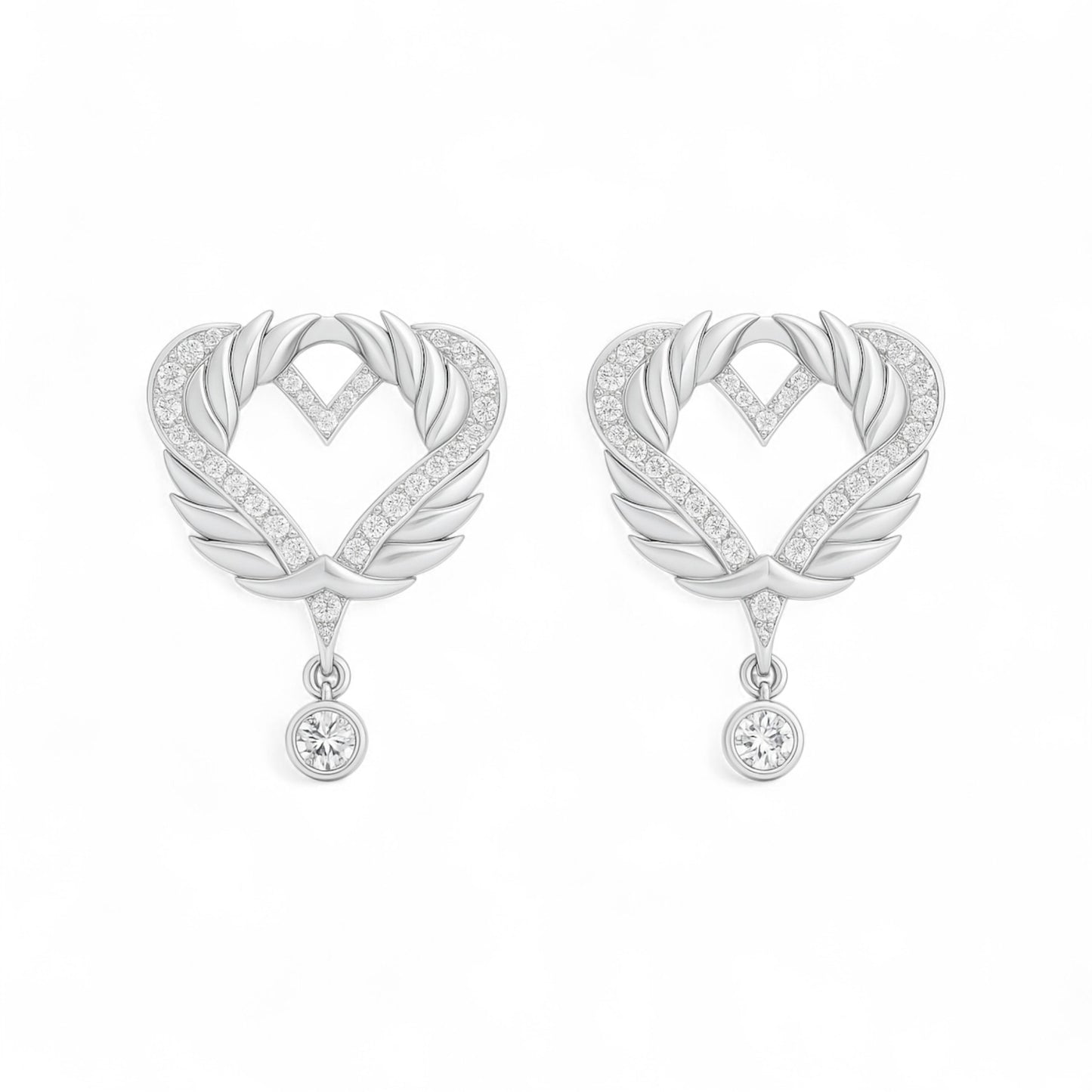 Pair of silver heart-shaped earrings with feather designs on a white background