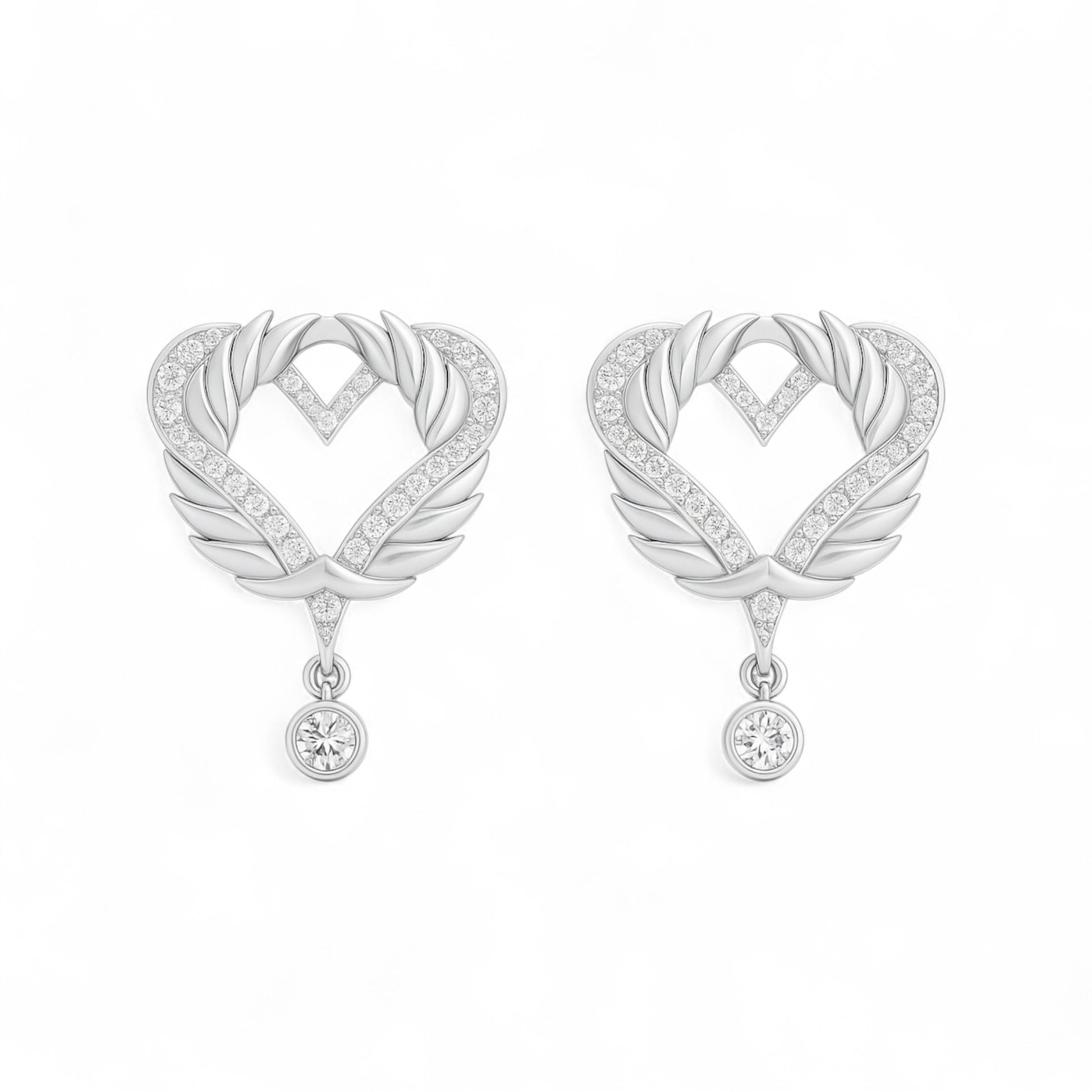 Pair of silver heart-shaped earrings with feather designs on a white background