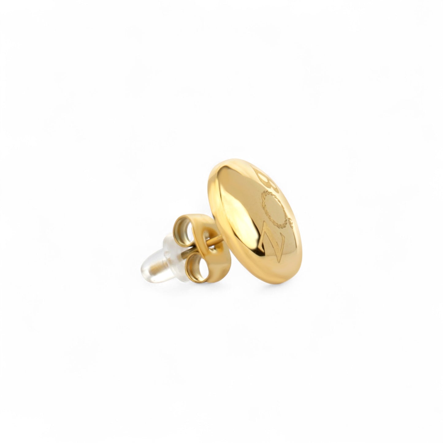 Gold earring on a white background