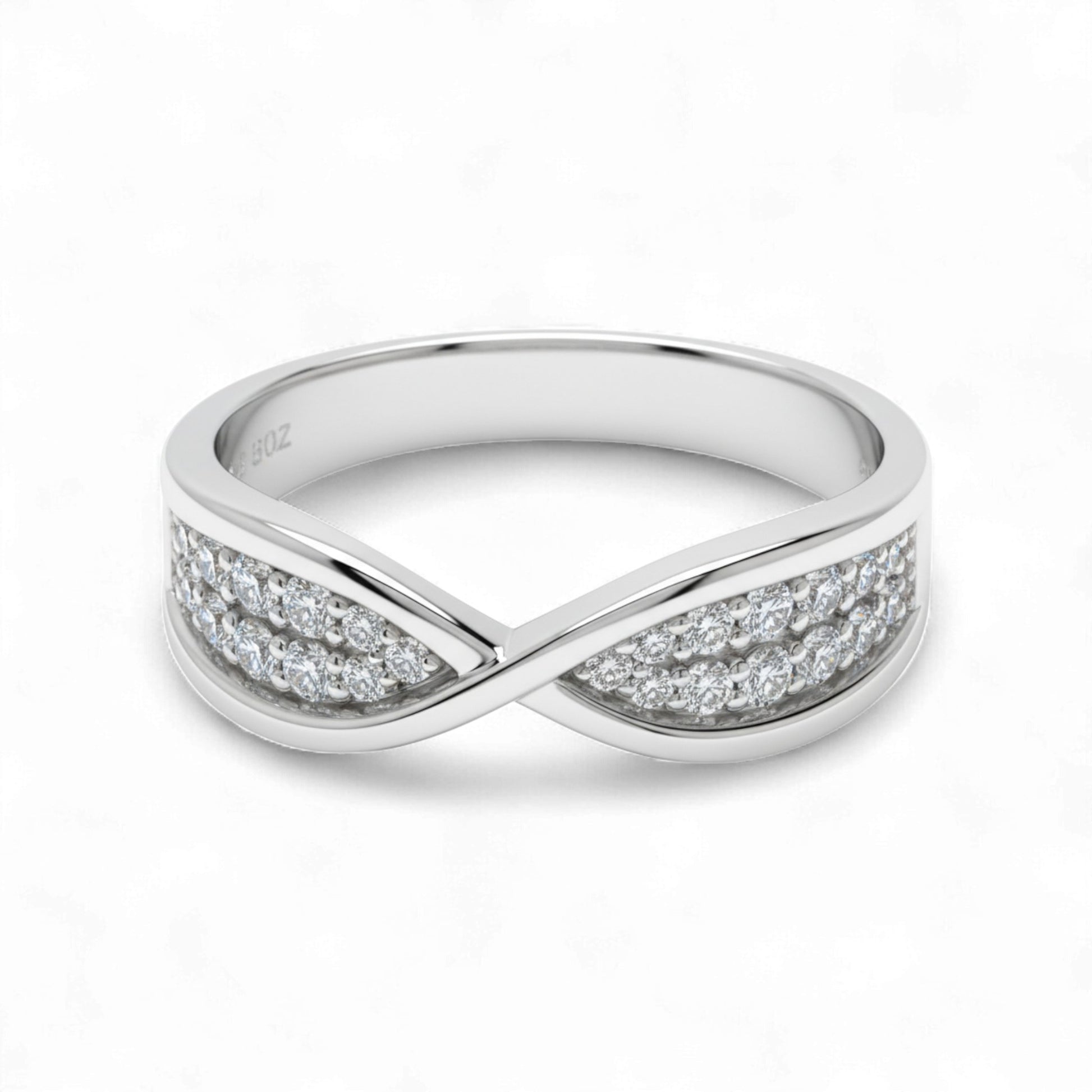 Silver ring with diamond accents on a white background