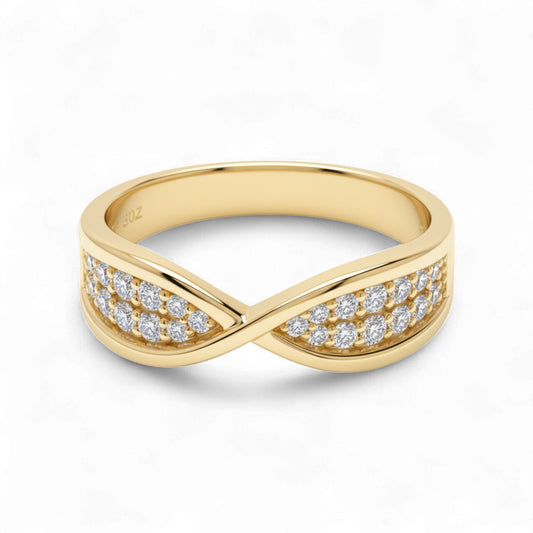 Gold ring with diamond accents on a white background