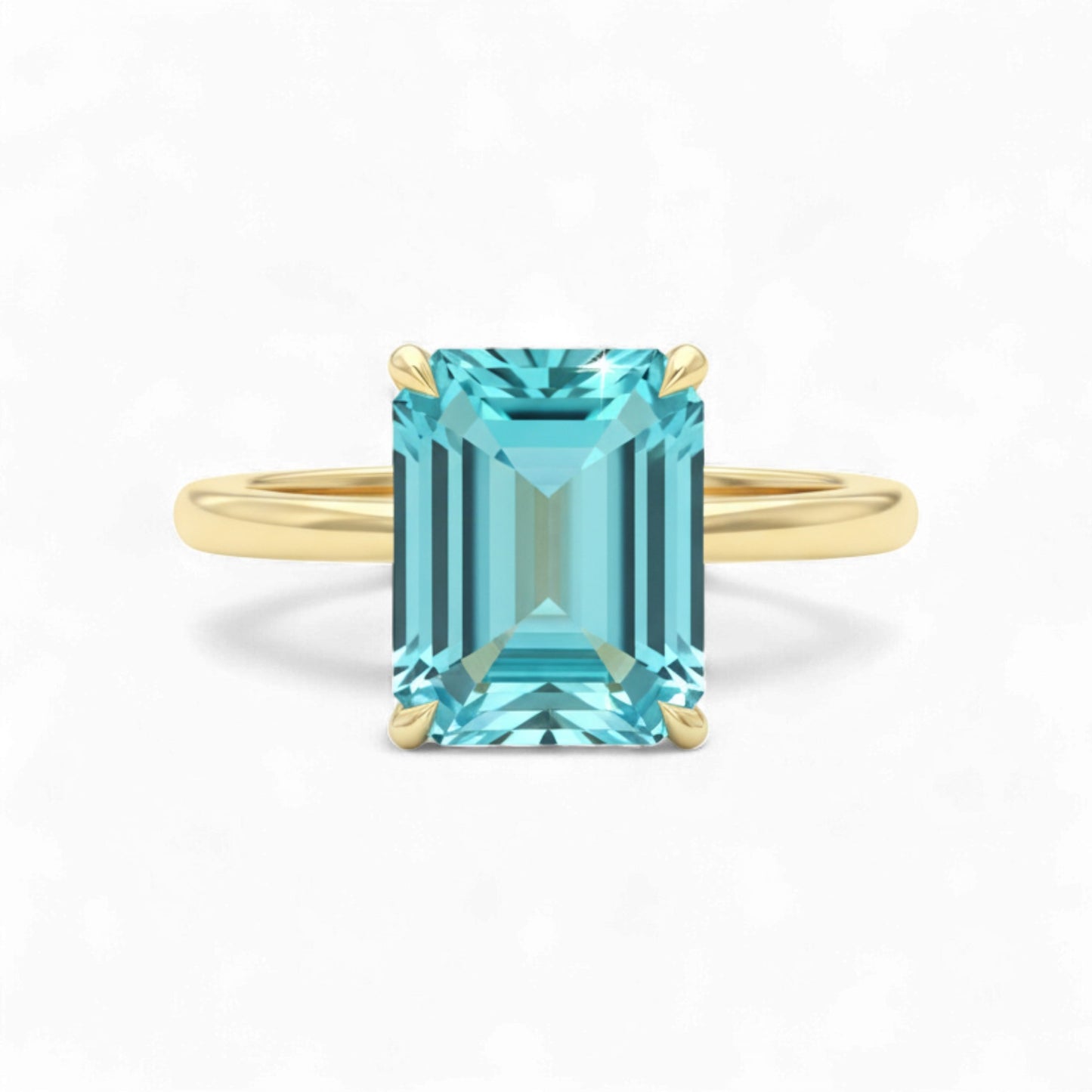 Gold ring with a rectangular blue gemstone on a white background