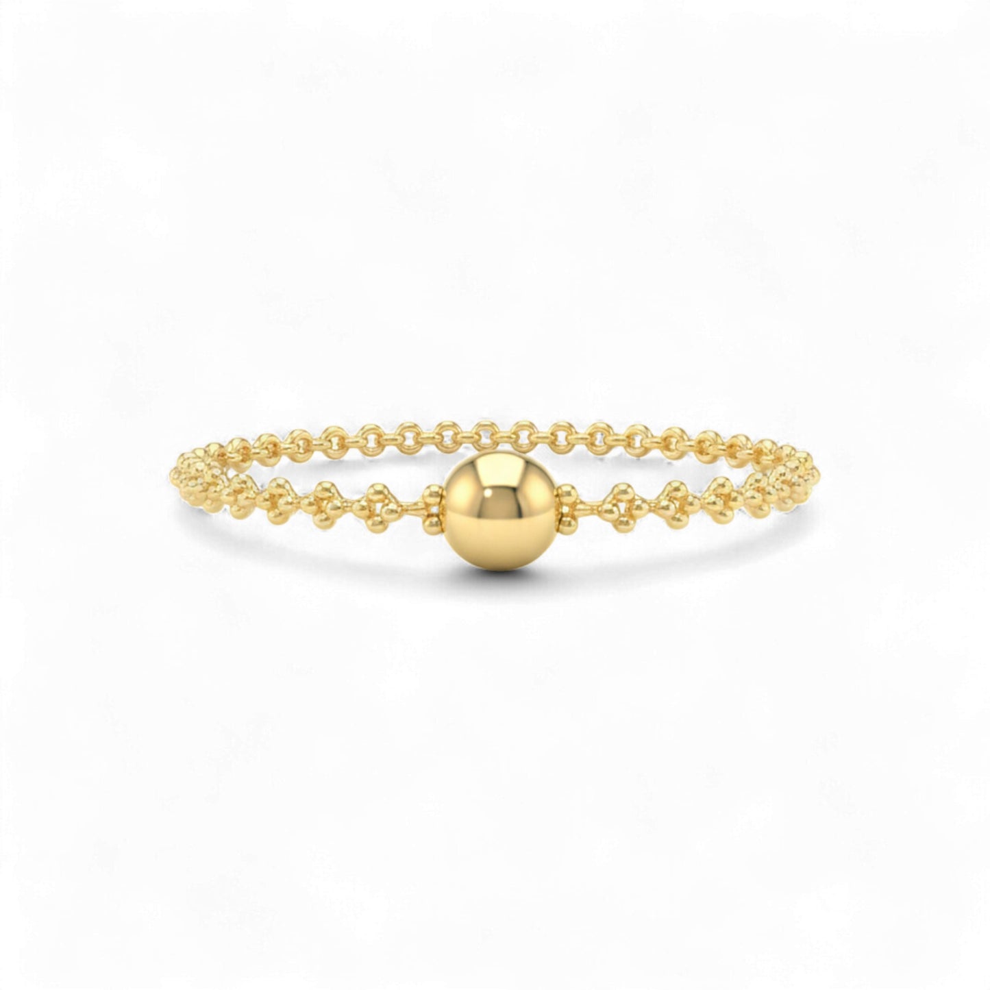 Gold bracelet with a round bead on a white background