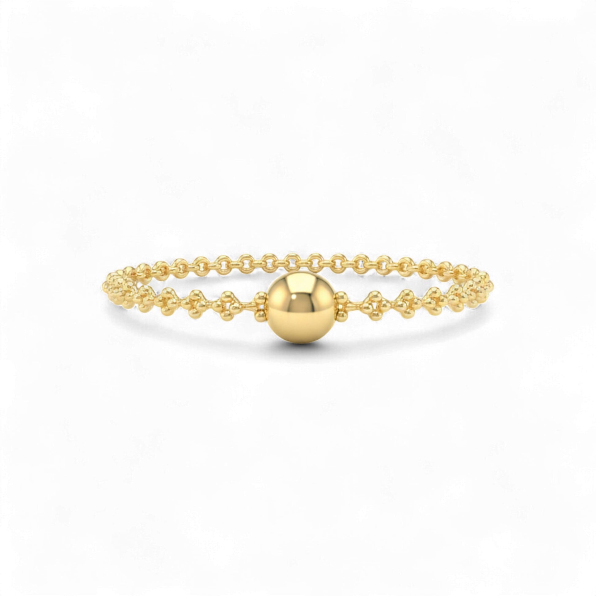 Gold bracelet with a round bead on a white background
