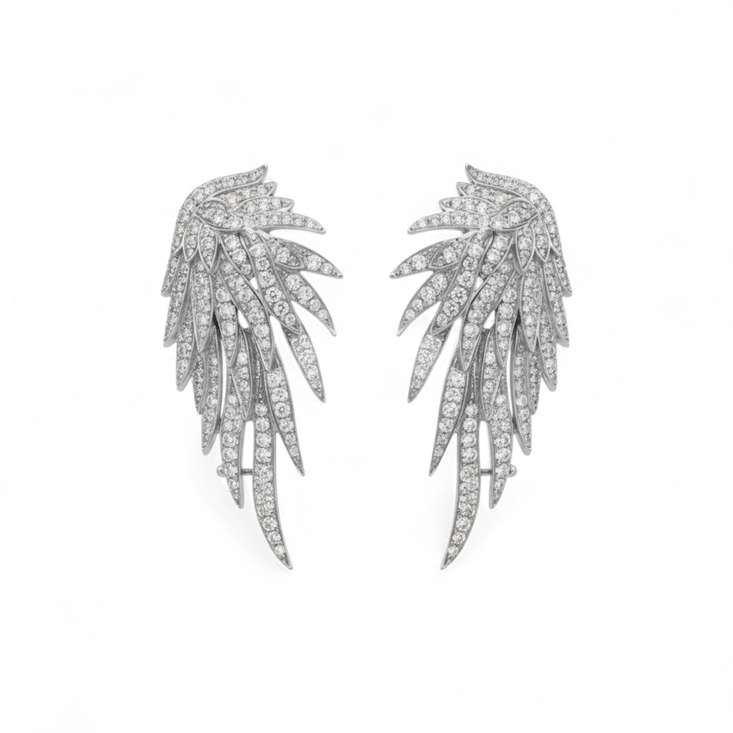Pair of silver leaf-shaped earrings on a white background